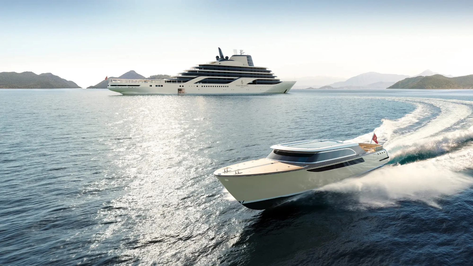A large white luxury yacht anchored near mountainous islands, with a high-speed tender boat